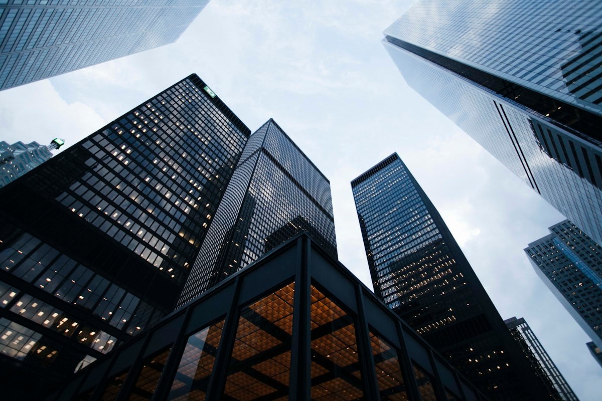 Modern glass architectural tower representing global platform scale
